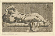 Cleopatra, partly naked laying on a bed