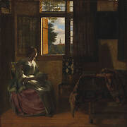 A Woman Reading a Letter by a Window