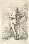 A warrior shown from behind holding a staff and leaning on a rock, from the series 'Figurine'