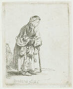 Beggar woman leaning on a stick