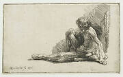 Nude man seated on the ground with one leg extended