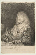 Man at a Desk Wearing a Cross and Chain